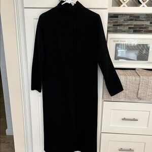 Soft wool/cashmere coat with snap closures. Unlined and unlabeled. 44” long.